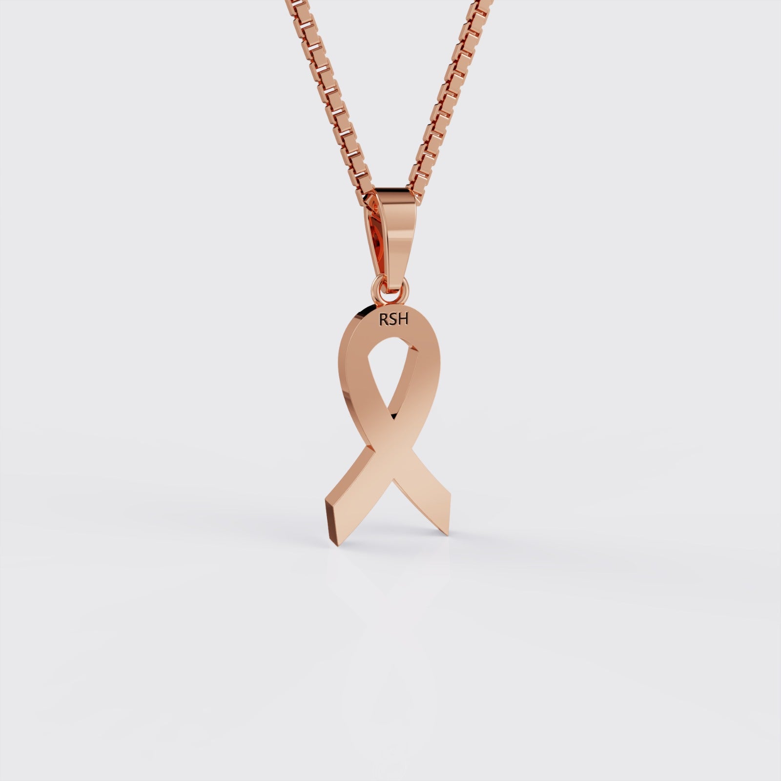 Back view of rose gold autism awareness ribbon pendant necklace.