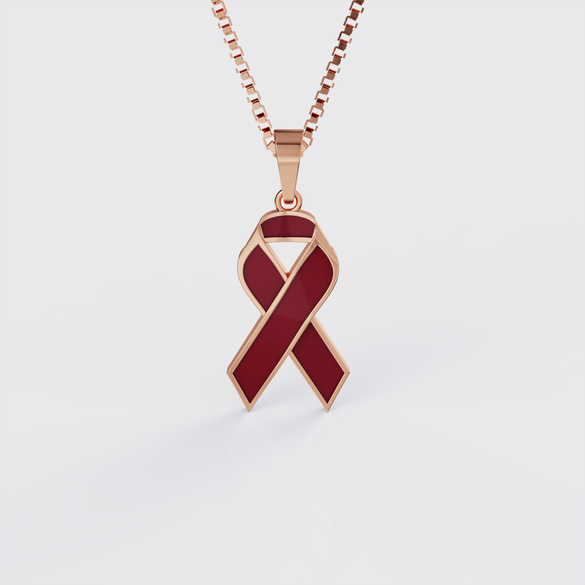 Rose gold sickle cell awareness ribbon pendant necklace with red enamel, front view.