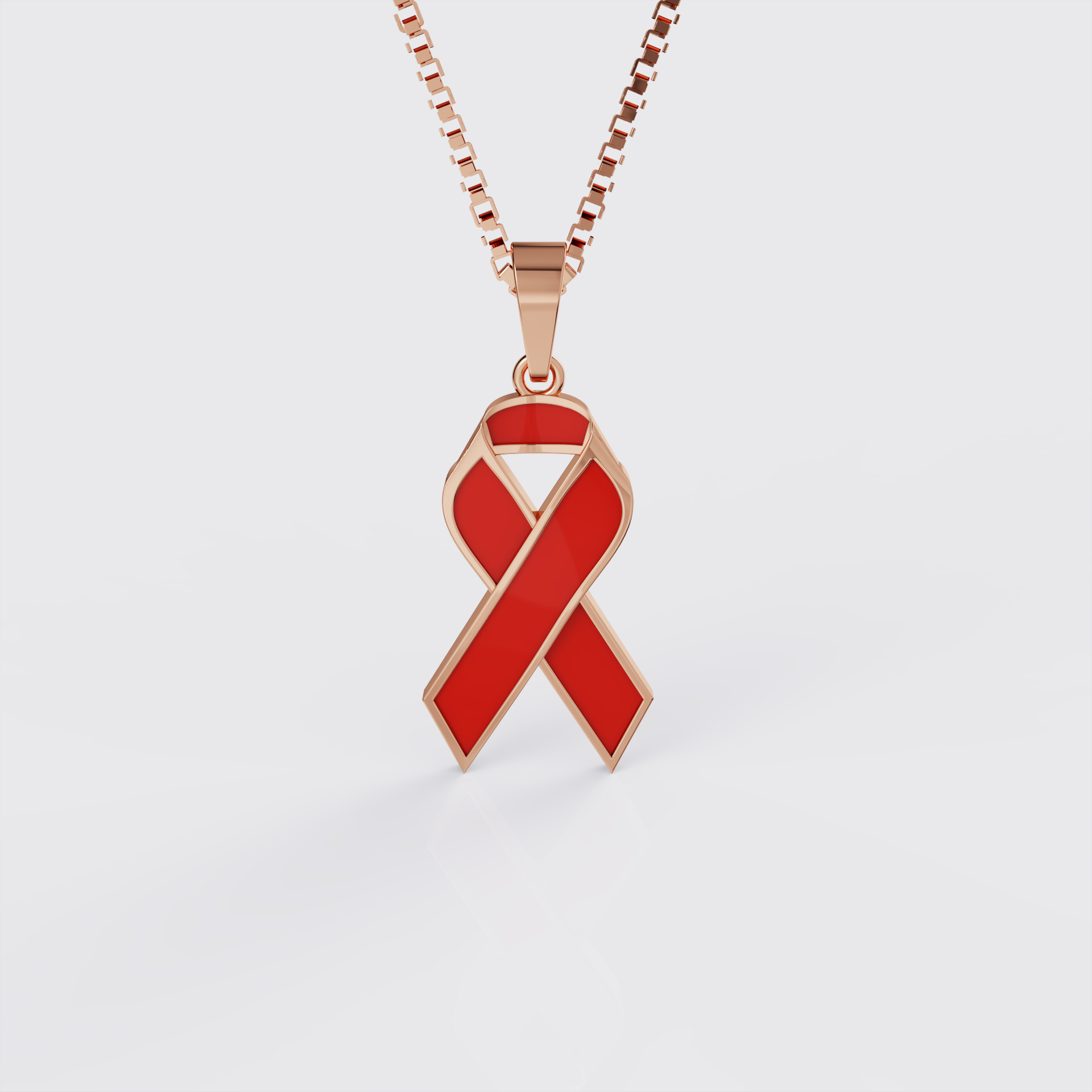 Rose gold HIV and AIDS awareness ribbon pendant necklace with red enamel, front view.