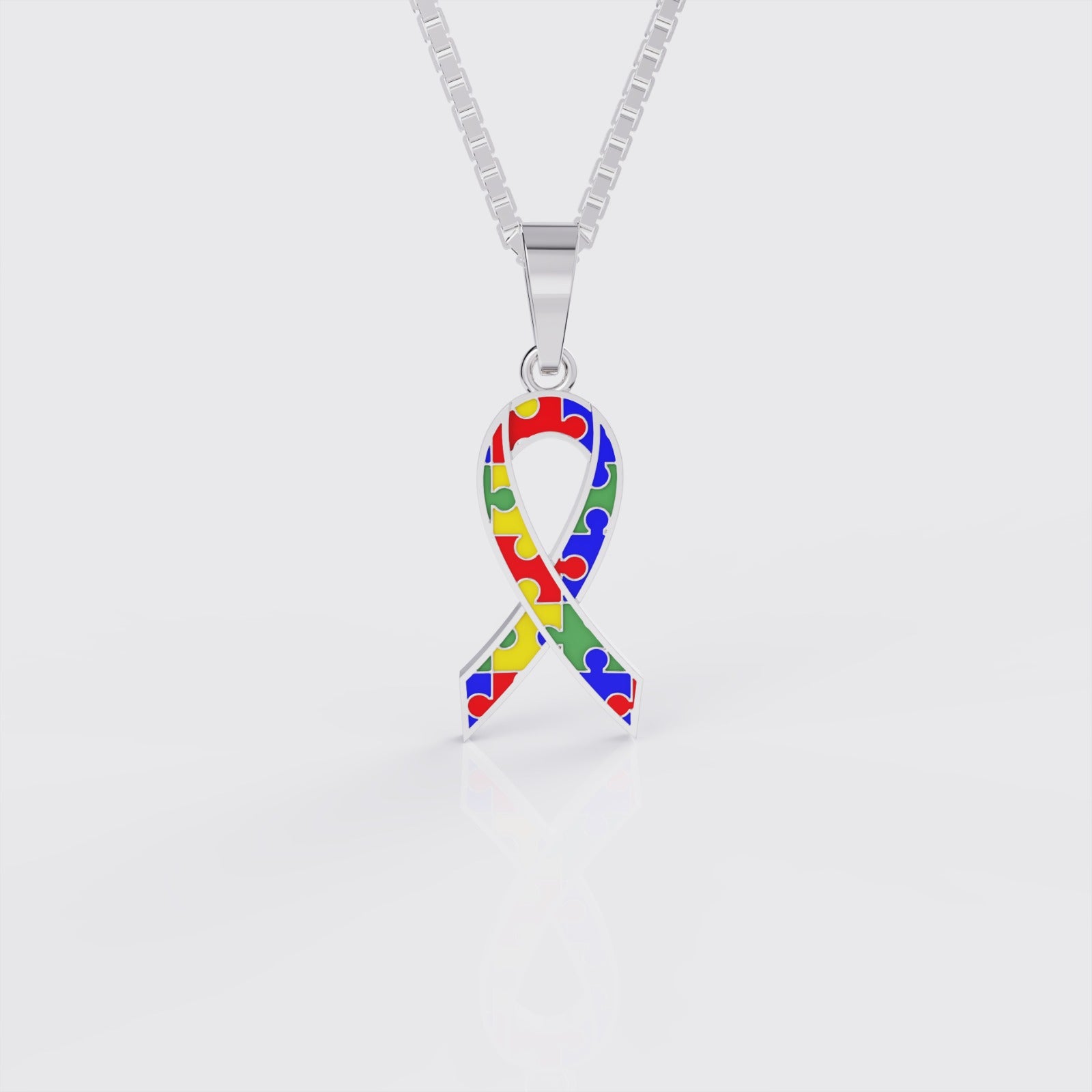 White gold autism awareness ribbon pendant necklace, front view.
