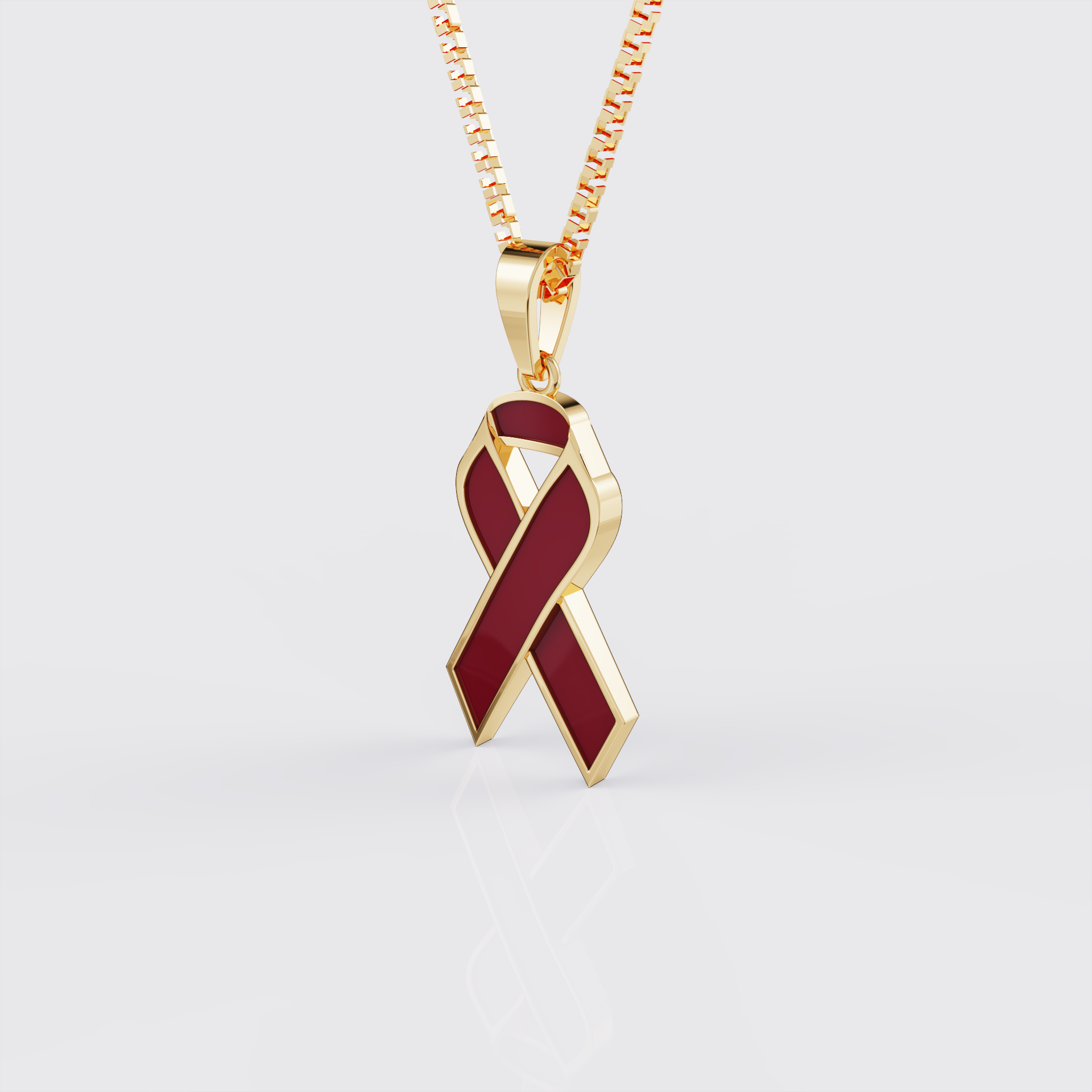 Side view of yellow gold sickle cell awareness ribbon pendant necklace.